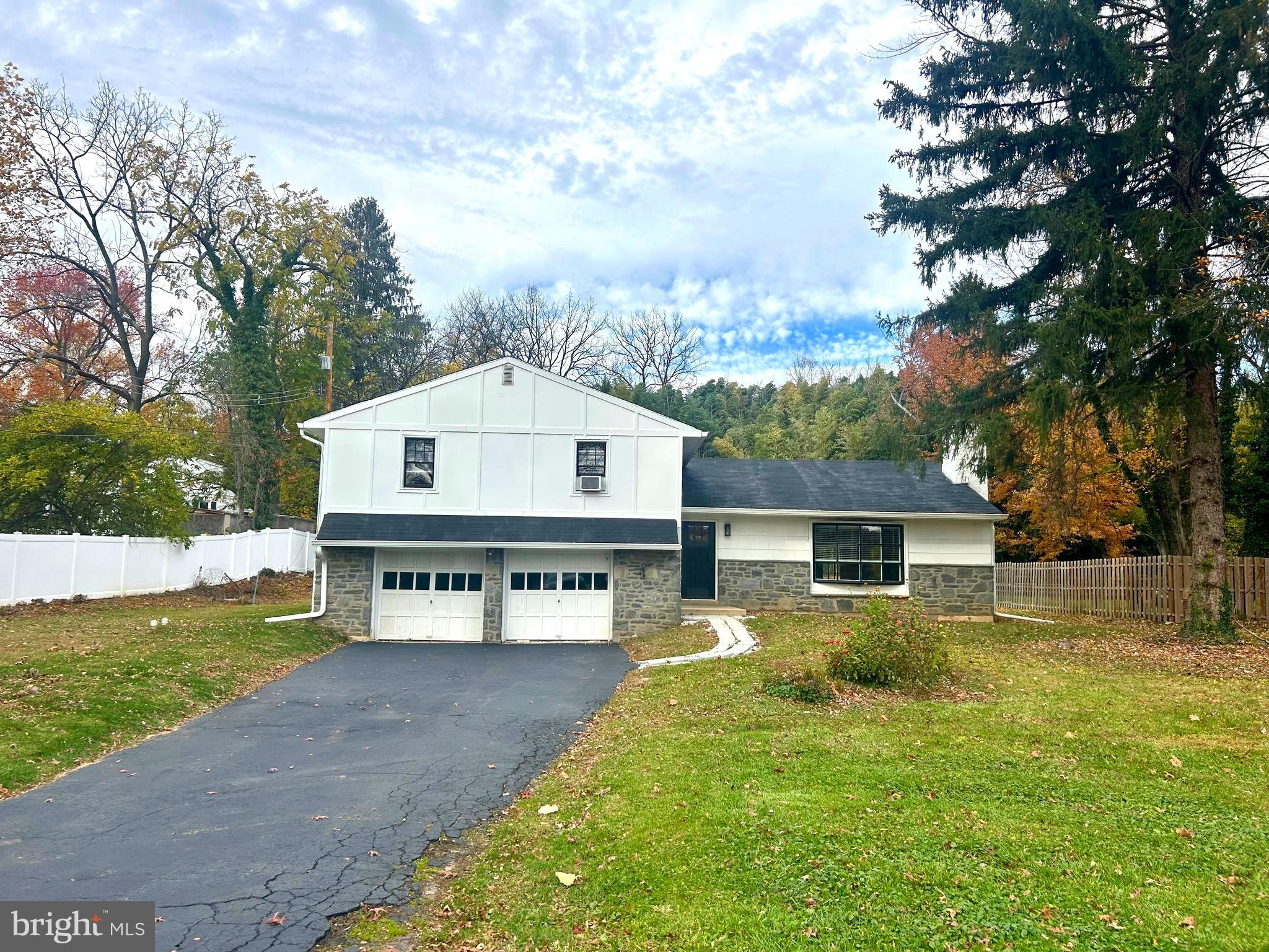 381 Upper Gulph Road Wayne, PA 19087 - Photo 16 of 17 a view of house with outdoor space and swimming pool