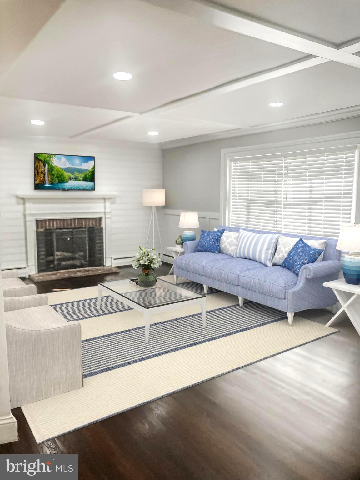 381 Upper Gulph Road Wayne, PA 19087 - Photo 2 of 17 a view of living room with furniture and a fireplace