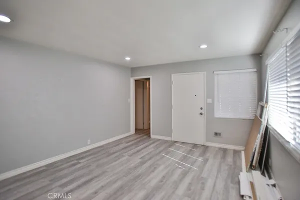 a view of livingroom with hardwood floor and a flat screen tv