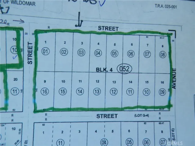 a kitchen with cabinets and a wooden floor