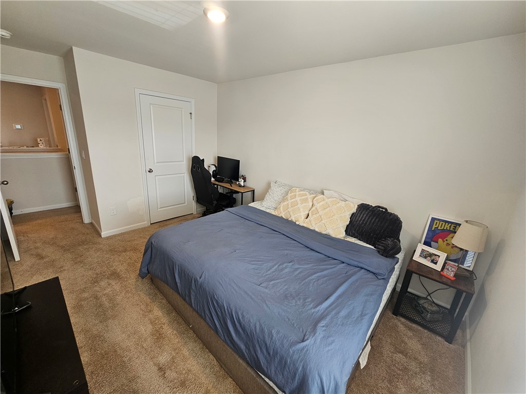 902 Ashwood Lane Easley, SC 29640 - Photo 29 of 39 A comfortable bedroom features plush carpeting and convenient access to the hallway.