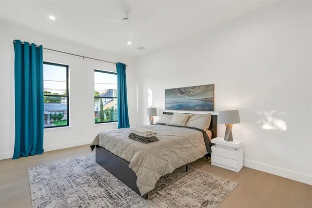 a bedroom with a bed and a table