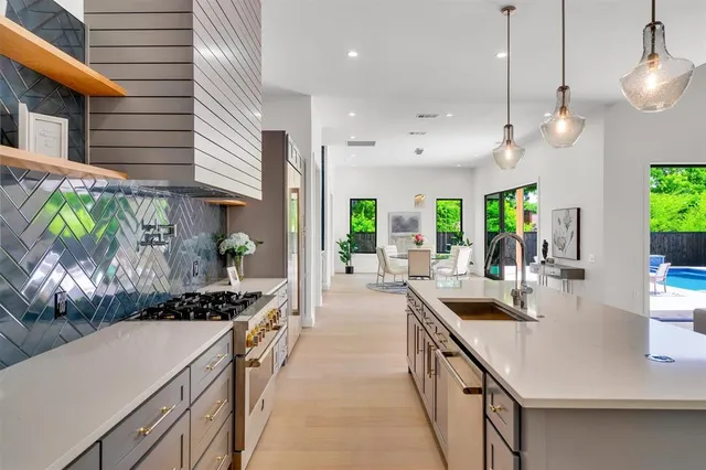 a kitchen with a sink cabinets and window