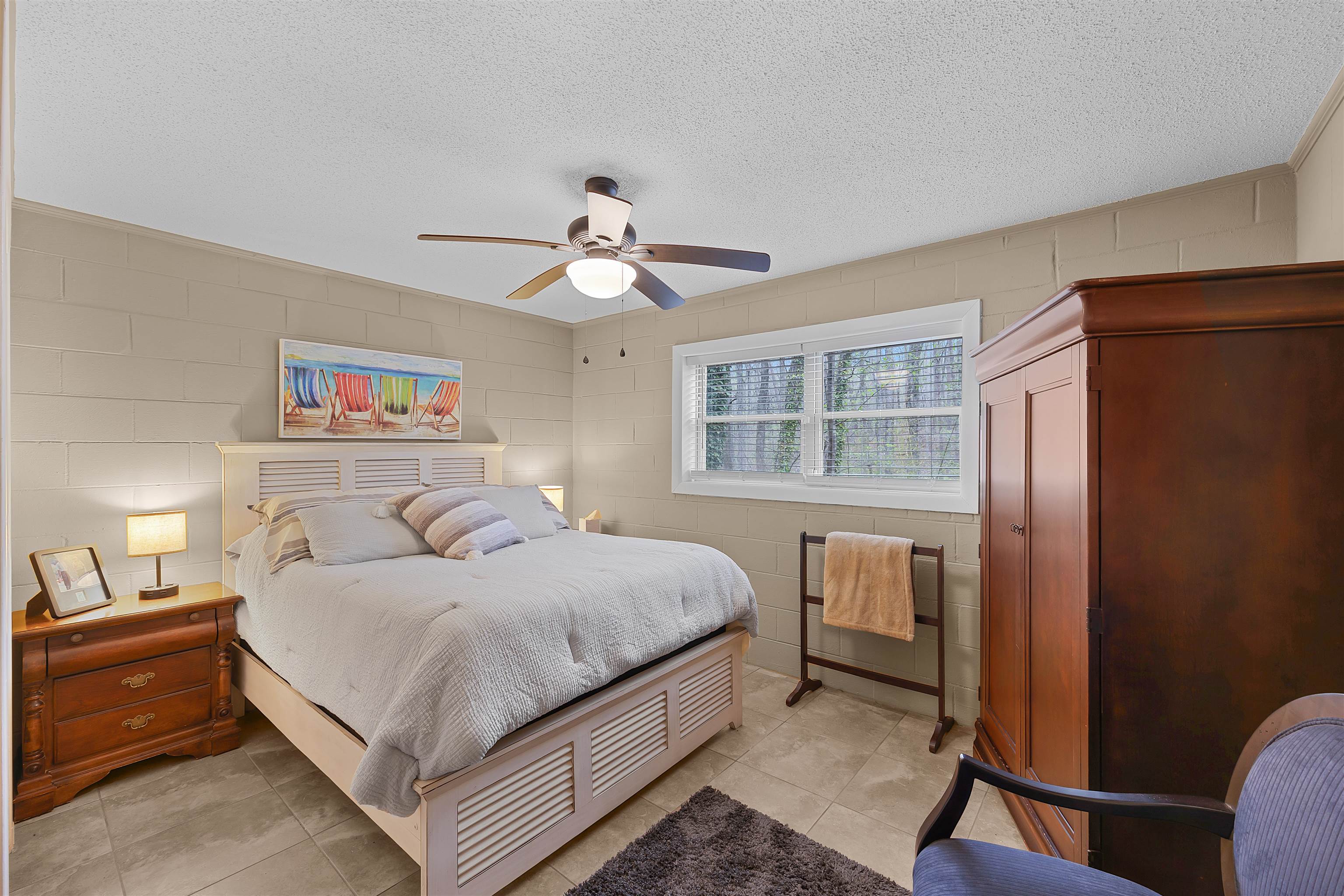 5 Cr 329 Road Iuka, MS 38852 - Photo 16 of 39 a bedroom with a large bed chandelier and a window