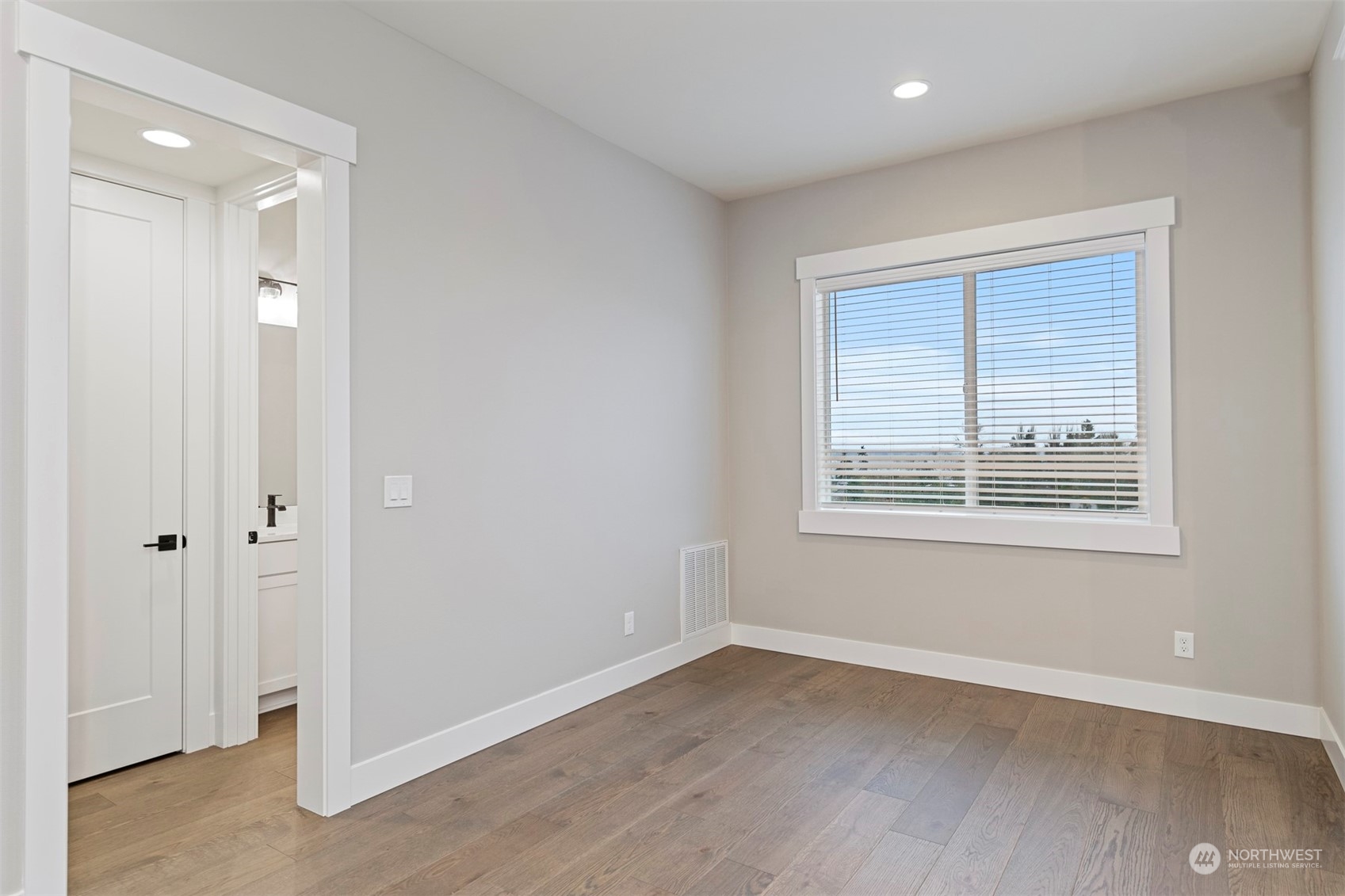 13015 75th Place South Seattle, WA 98178 - Photo 17 of 32 a view of an empty room with wooden floor and a window