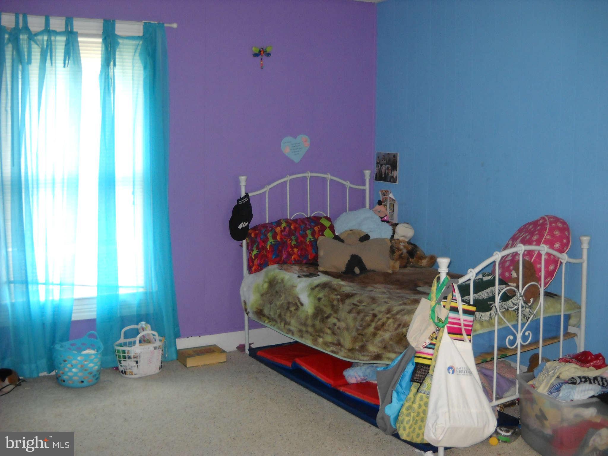 415 Hill Street Culpeper, VA 22701 - Photo 11 of 14 a bedroom with furniture and a wooden floor