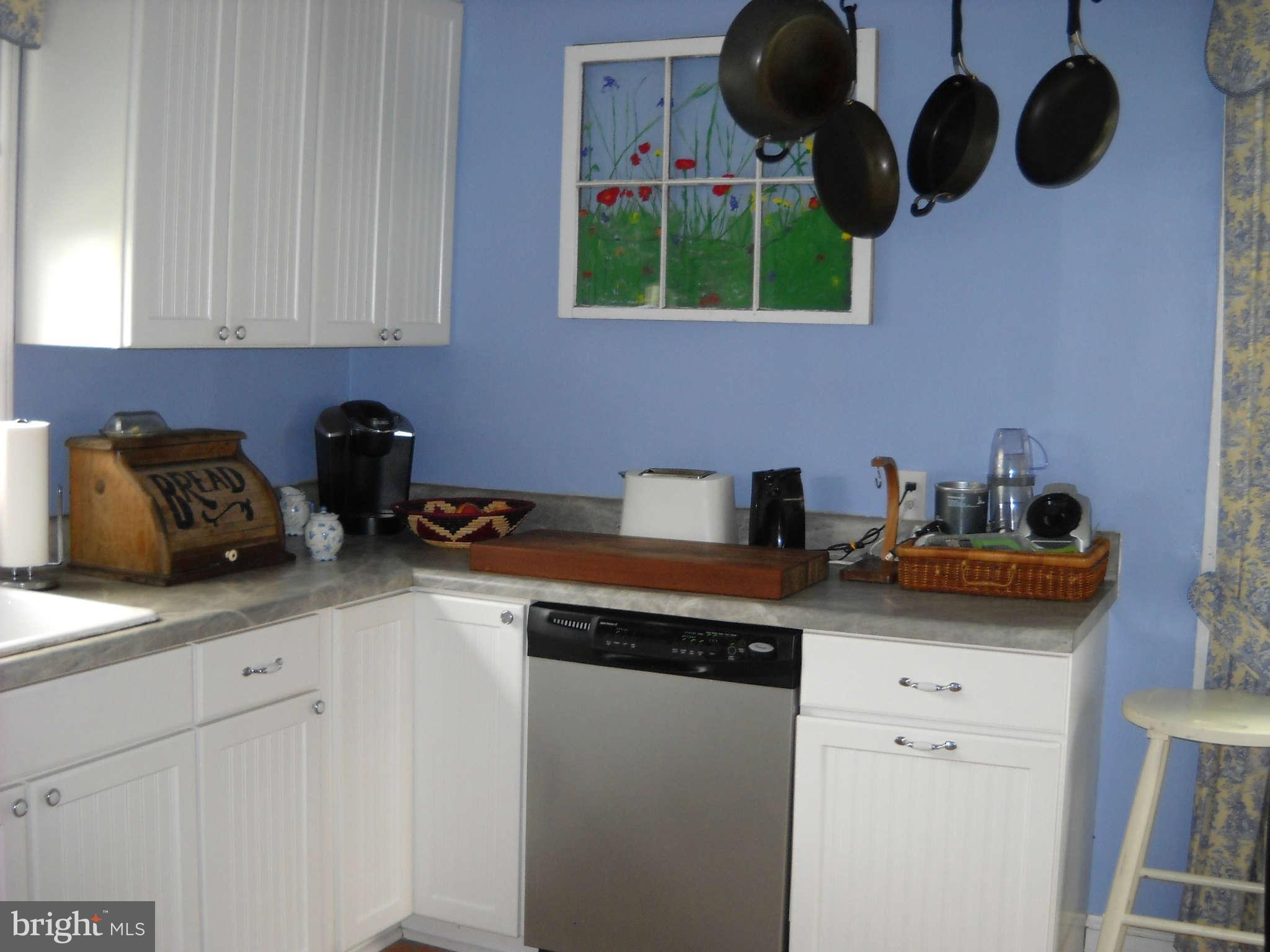 415 Hill Street Culpeper, VA 22701 - Photo 8 of 14 a kitchen with a sink cabinets and appliances