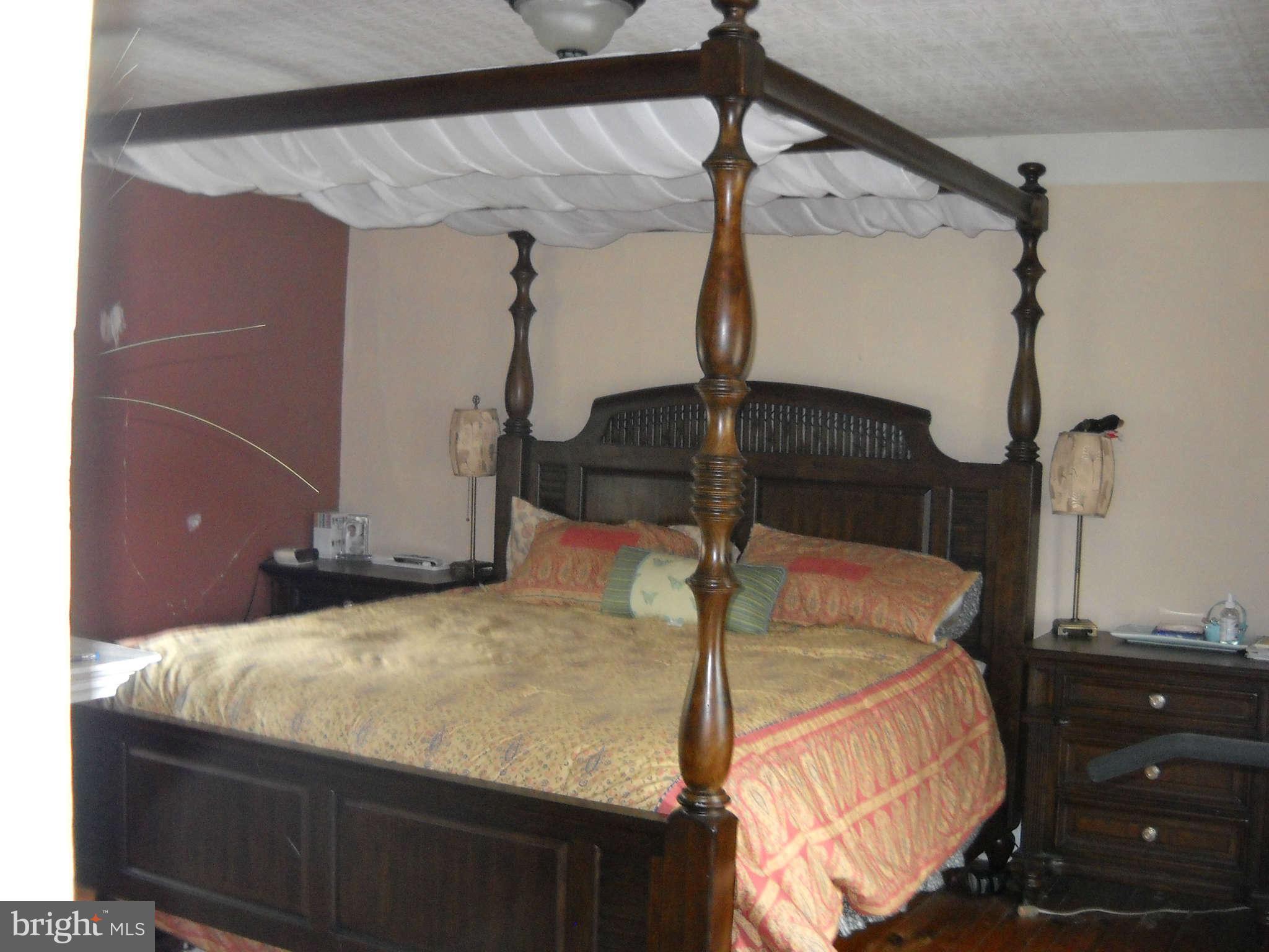 415 Hill Street Culpeper, VA 22701 - Photo 10 of 14 a bed sitting in a room next to a window