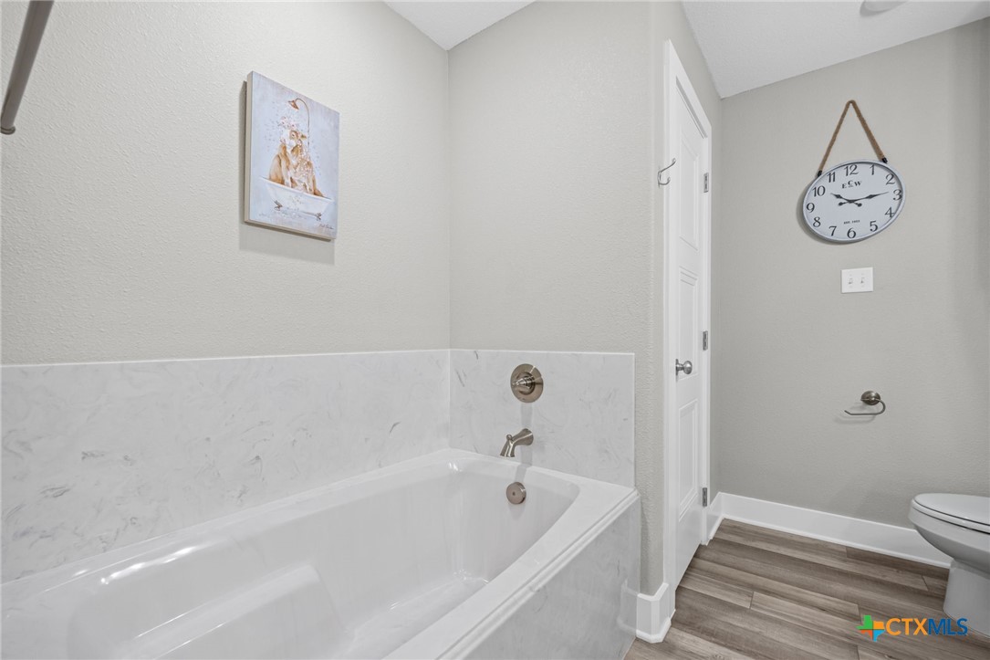 28099 Fm 2670 Killeen, TX 76549 - Photo 23 of 48 a bathroom with a bathtub and a shower