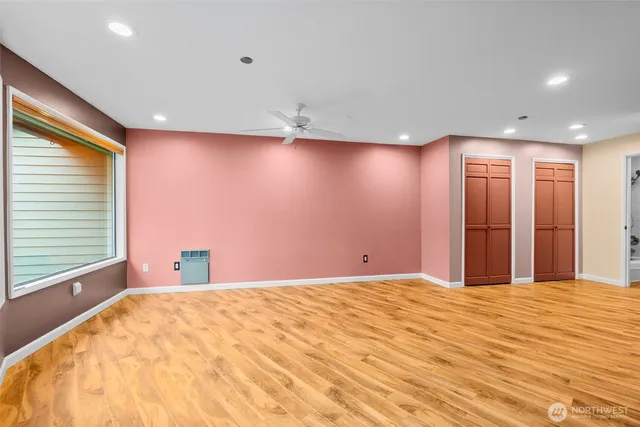 a bathroom with a toilet and a bathtub