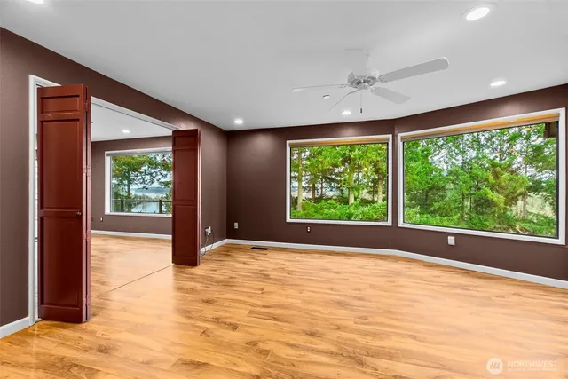 a bathroom with a sink toilet a mirror and shower