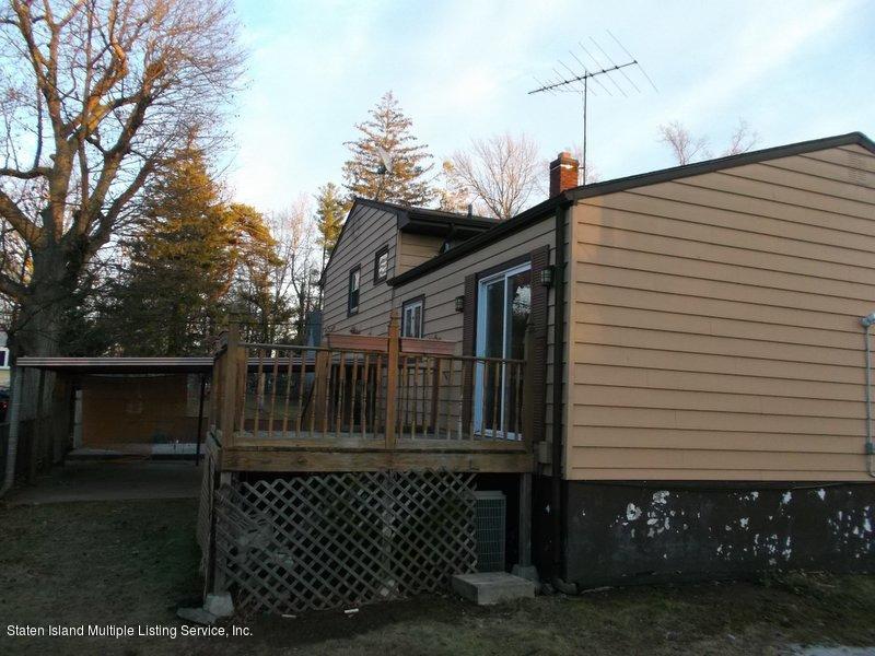 1 Sarno Street Colonia, NJ 07067 - Photo 19 of 30 a front view of a house with fence