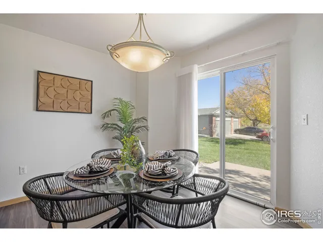 a kitchen with stainless steel appliances a stove a sink a microwave a refrigerator and cabinets