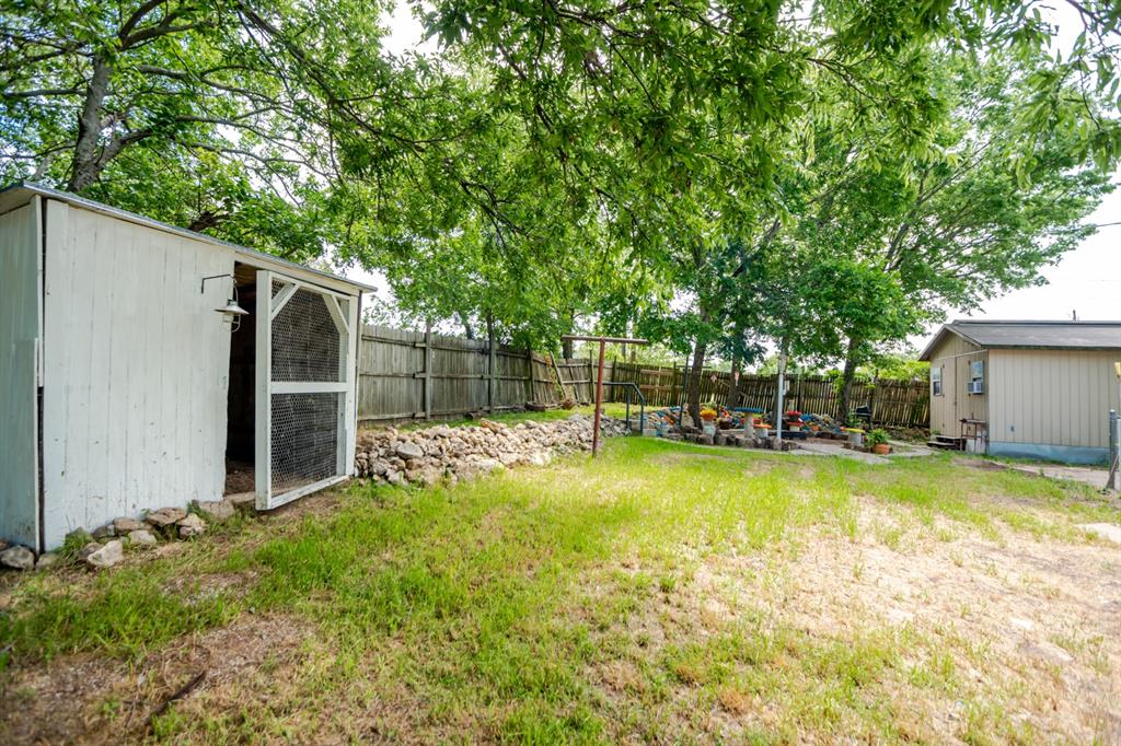 199 B.C. Rhome Avenue Rhome, TX 76078 - Photo 9 of 34 a view of a backyard with swimming pool
