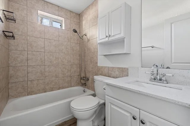 a bathroom with a sink toilet and bathtub