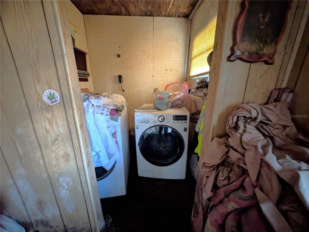 2516 Hebb Road Auburndale, FL 33823 - Photo 19 of 55 a view of walk in closet with clothes and shoes