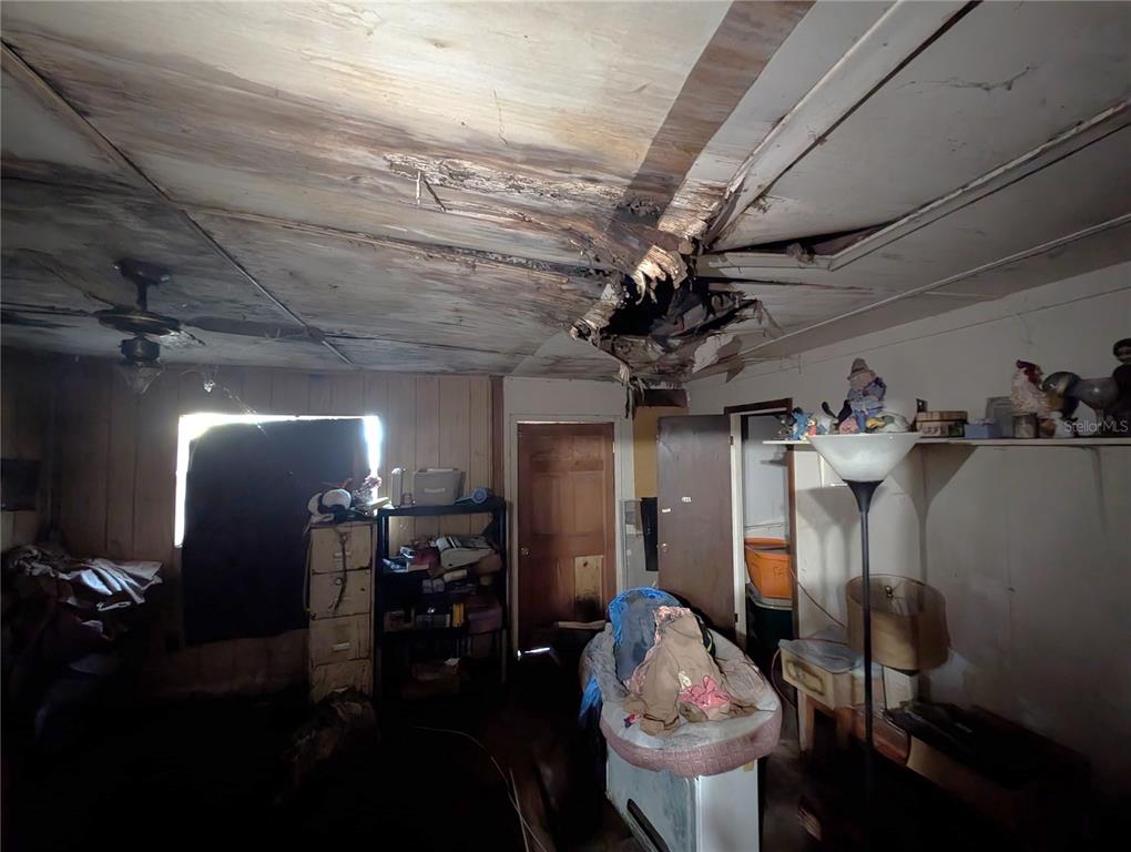 2516 Hebb Road Auburndale, FL 33823 - Photo 25 of 55 a view of a room with wooden floor and chandelier