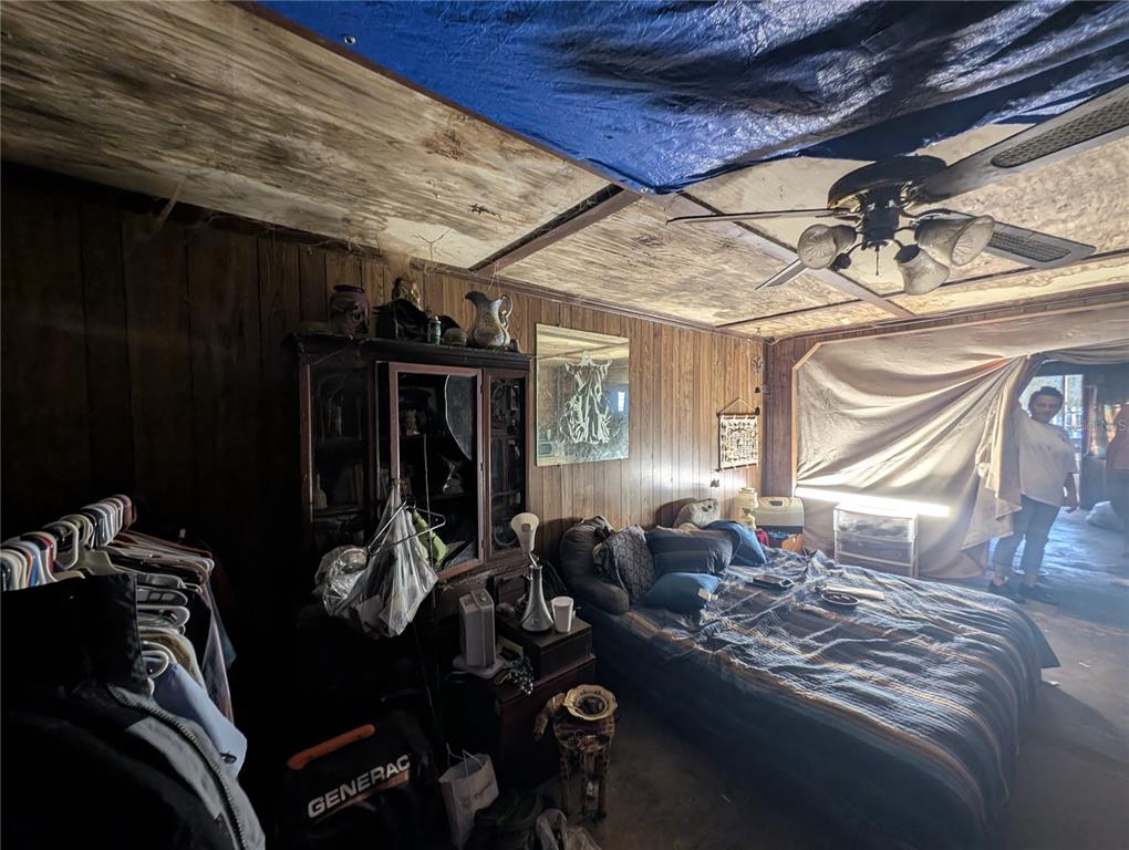 2516 Hebb Road Auburndale, FL 33823 - Photo 30 of 55 a living room with furniture a window and gym equipment