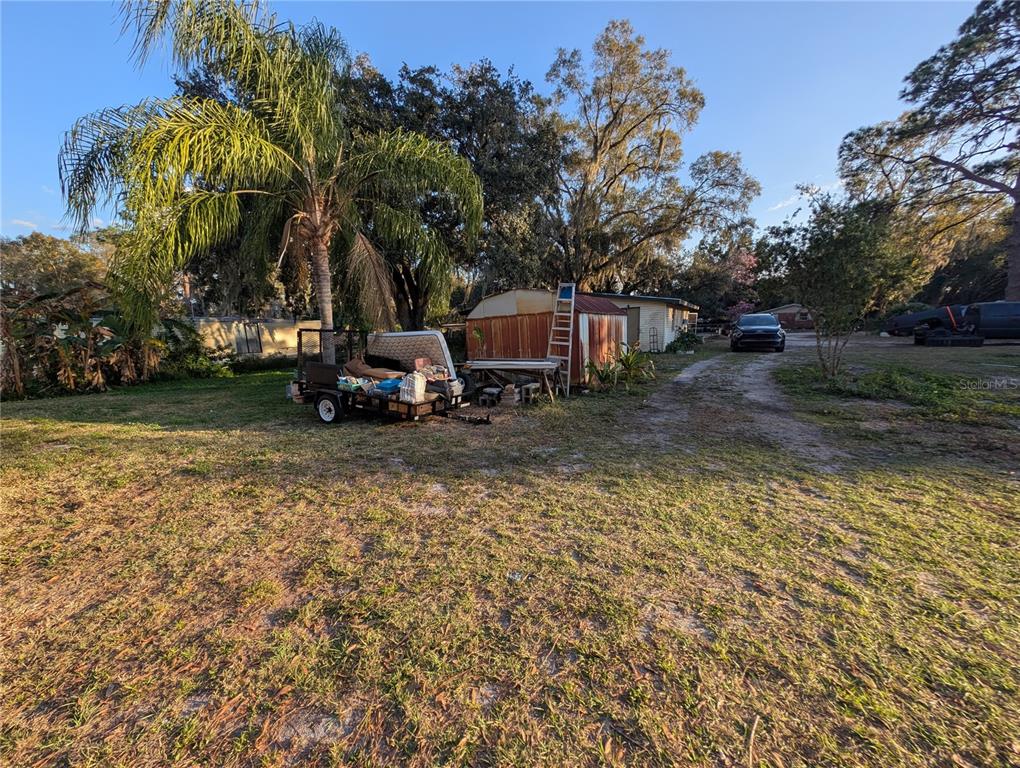 2516 Hebb Road Auburndale, FL 33823 - Photo 43 of 55 a backyard of a house with lots of green space