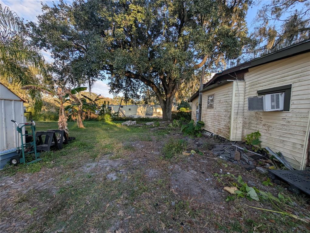 2516 Hebb Road Auburndale, FL 33823 - Photo 45 of 55 a backyard of a house with lots of green space