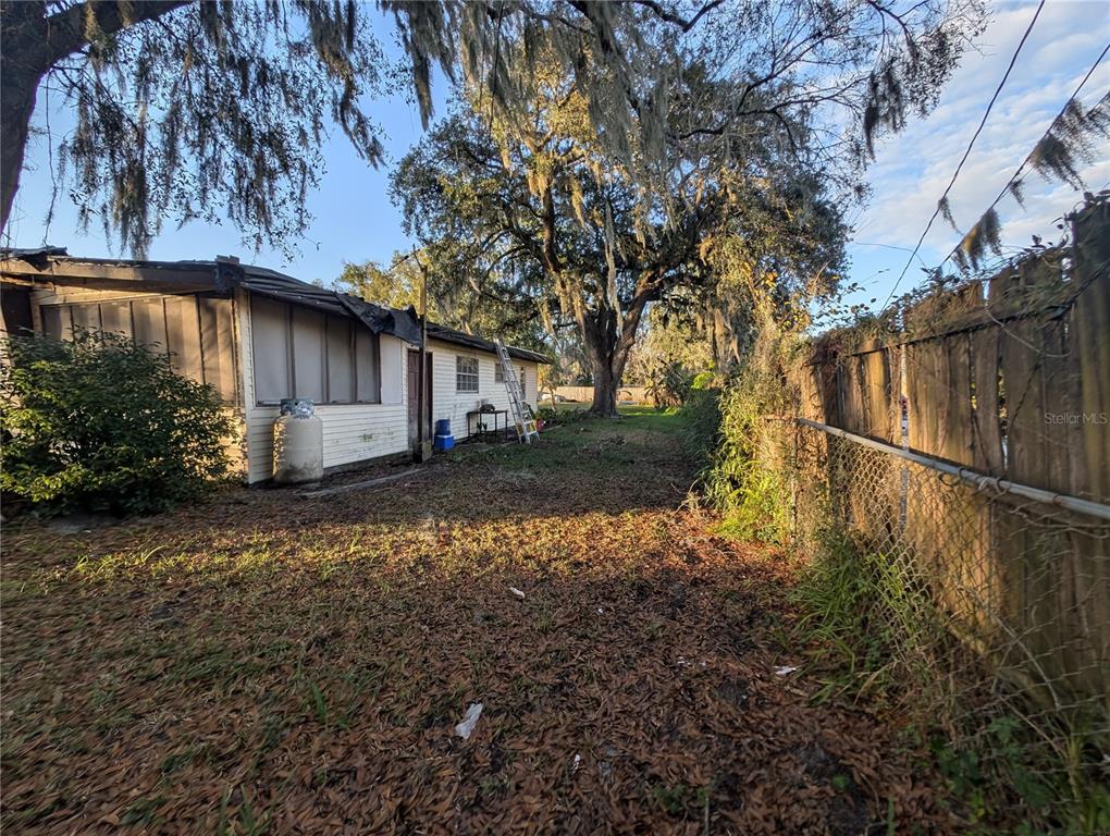 2516 Hebb Road Auburndale, FL 33823 - Photo 51 of 55 a backyard of a house with lots of green space