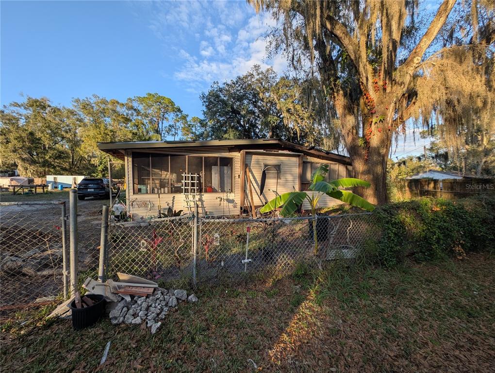 2516 Hebb Road Auburndale, FL 33823 - Photo 52 of 55 a view of a house with backyard and sitting area