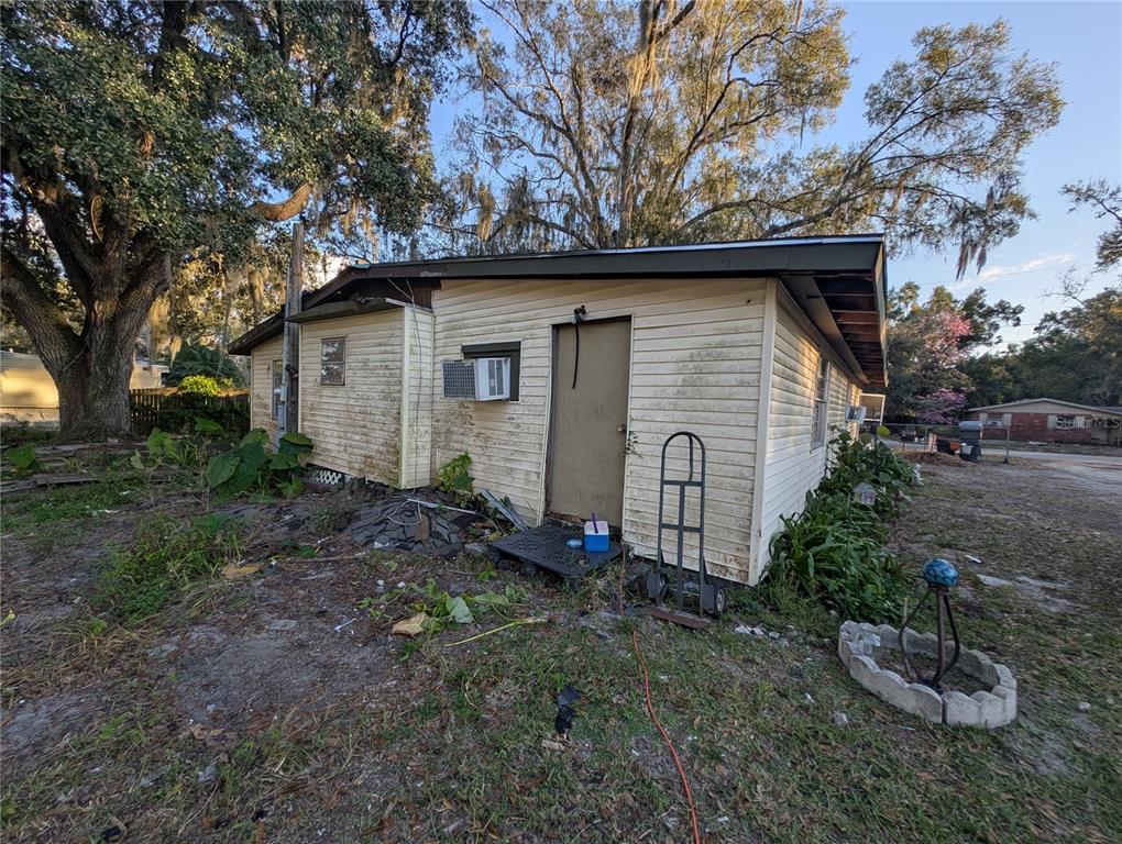 2516 Hebb Road Auburndale, FL 33823 - Photo 55 of 55 a backyard of a house with plants and large tree