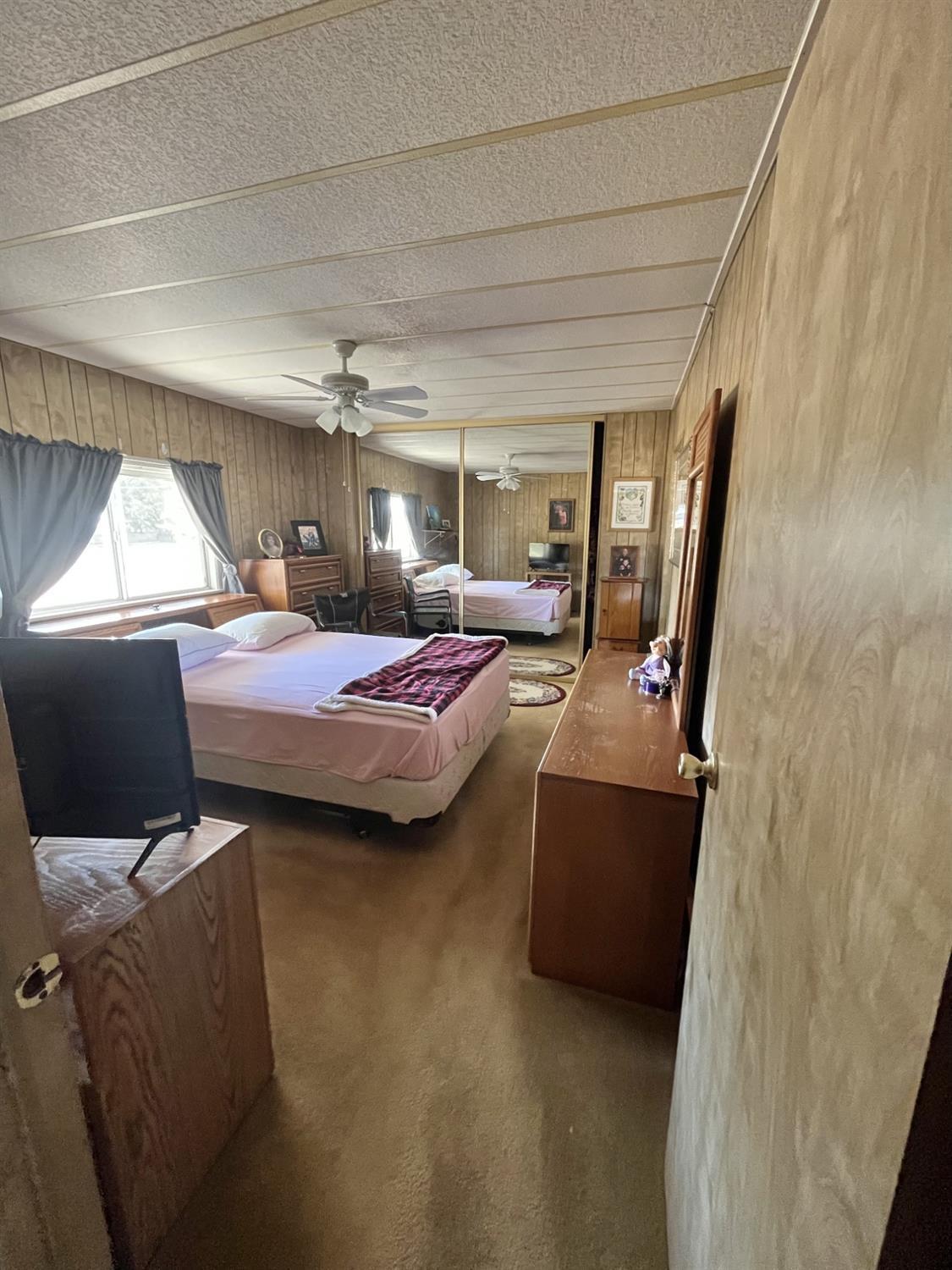 33188 George Smith Road Squaw Valley, CA 93675 - Photo 13 of 43 a bedroom with bed and window