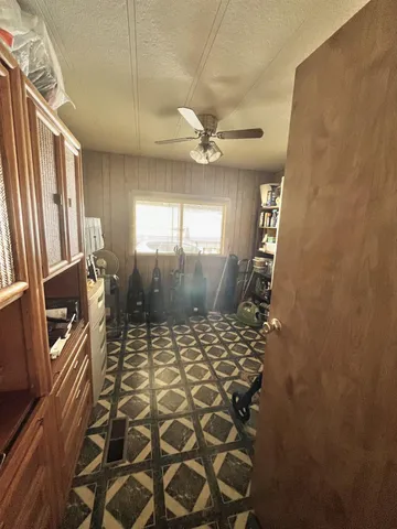 a bathroom with a glass shower door and a window