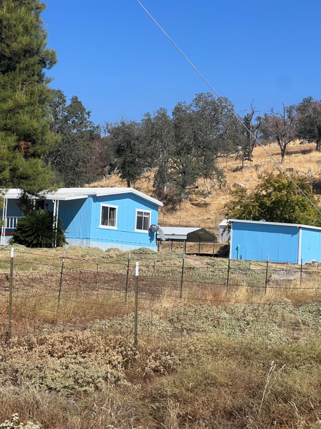 33188 George Smith Road Squaw Valley, CA 93675 - Photo 22 of 43 a view of a house with a yard