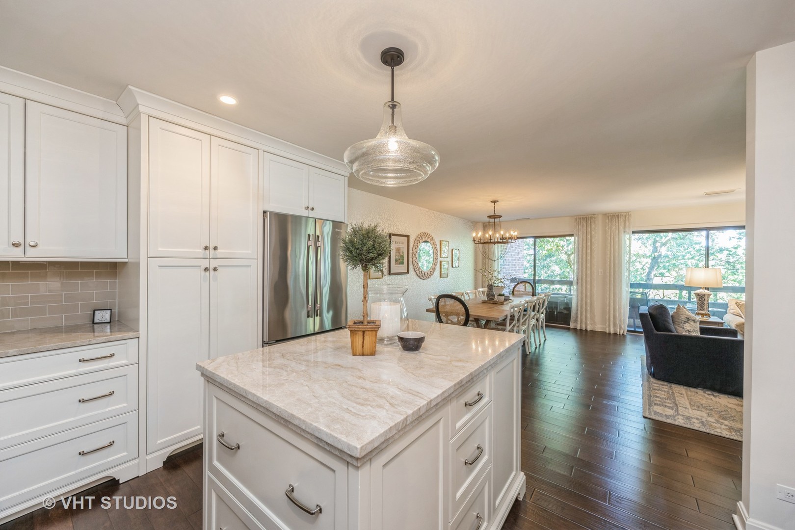 1409 Burr Oak Road, Unit 315A Hinsdale, IL 60521 - Photo 12 of 22 a kitchen with a center island appliances and windows