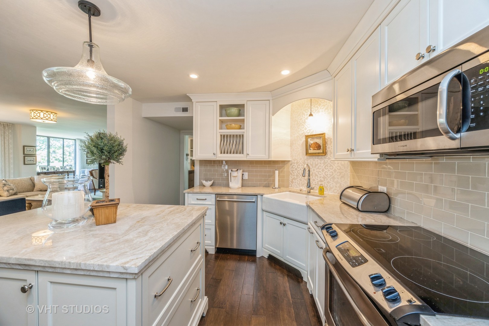 1409 Burr Oak Road, Unit 315A Hinsdale, IL 60521 - Photo 13 of 22 a kitchen with a sink stainless steel appliances and cabinets