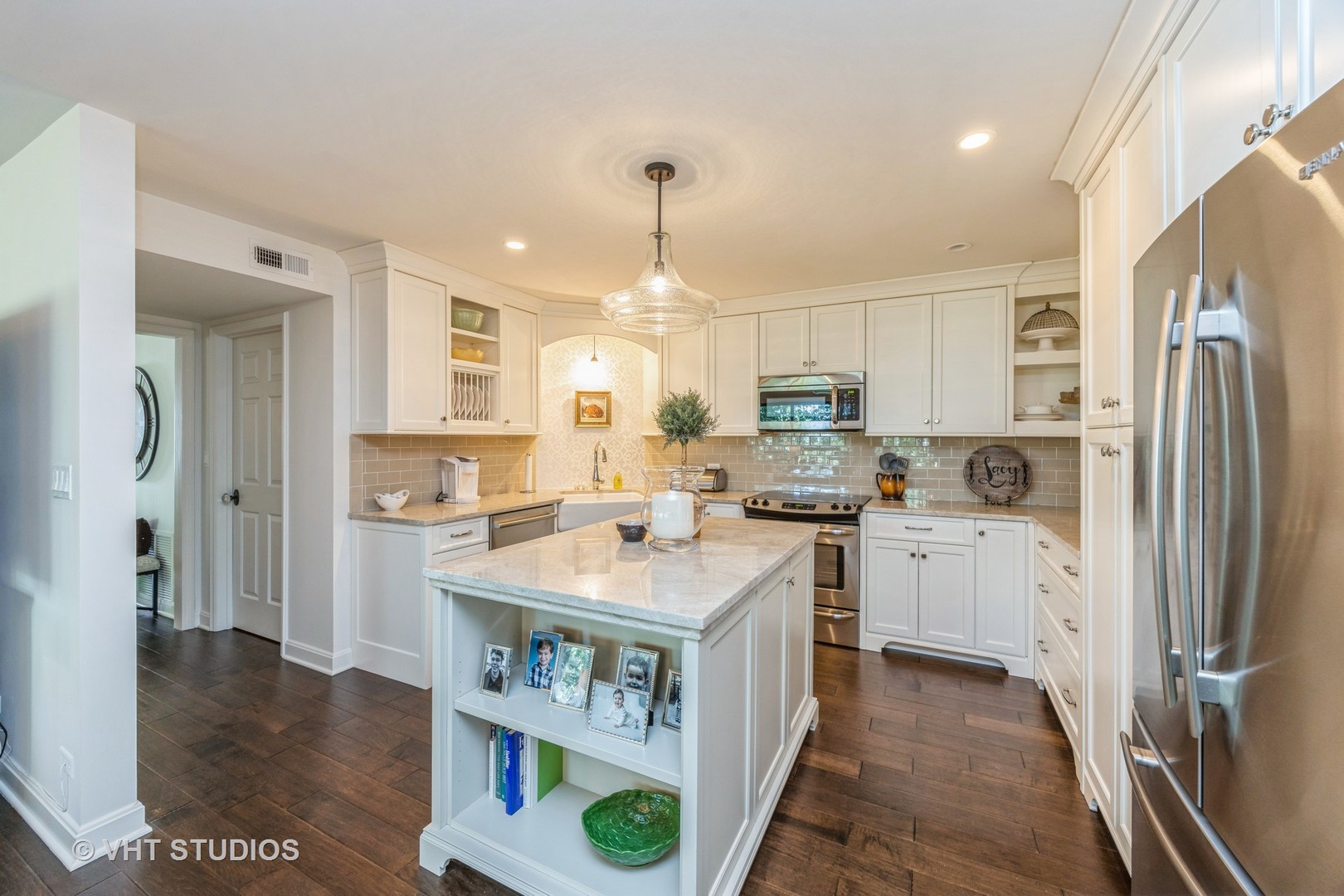 1409 Burr Oak Road, Unit 315A Hinsdale, IL 60521 - Photo 14 of 22 a kitchen with a refrigerator a sink dishwasher and a stove with wooden floor