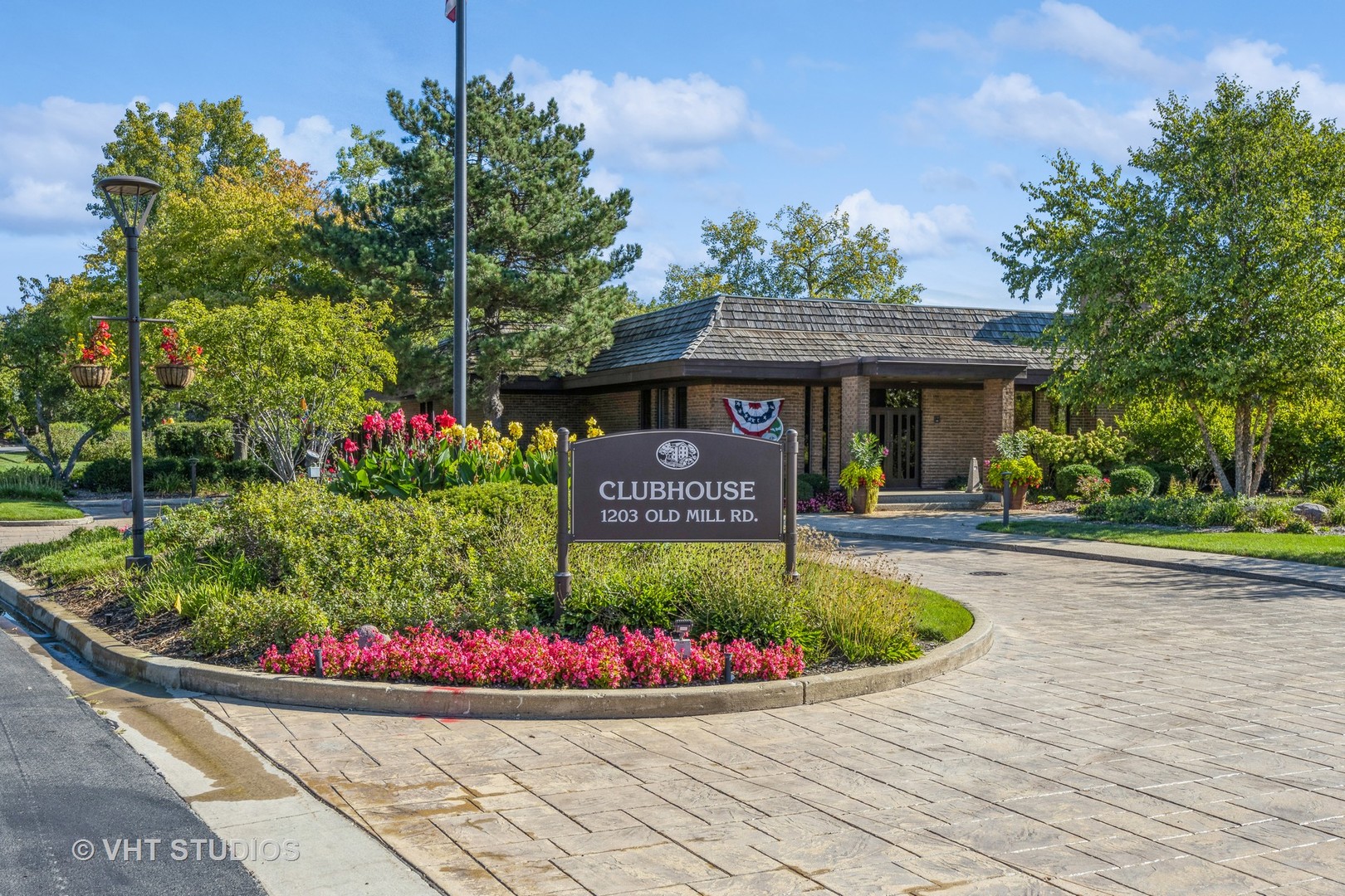 1409 Burr Oak Road, Unit 315A Hinsdale, IL 60521 - Photo 2 of 22 a view of a house with a garden and pathway