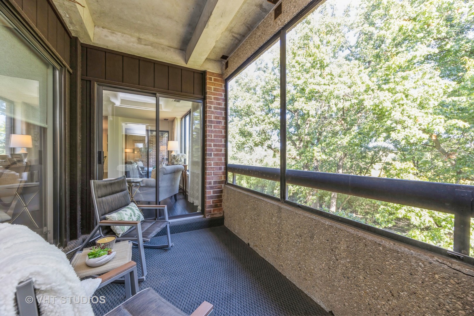 1409 Burr Oak Road, Unit 315A Hinsdale, IL 60521 - Photo 22 of 22 a view of a porch with furniture and floor to ceiling window