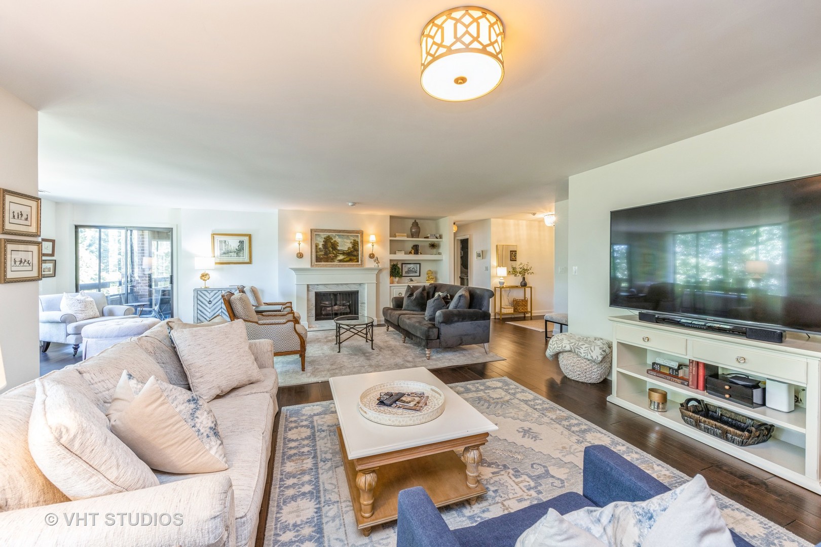 1409 Burr Oak Road, Unit 315A Hinsdale, IL 60521 - Photo 7 of 22 a living room with furniture and a flat screen tv