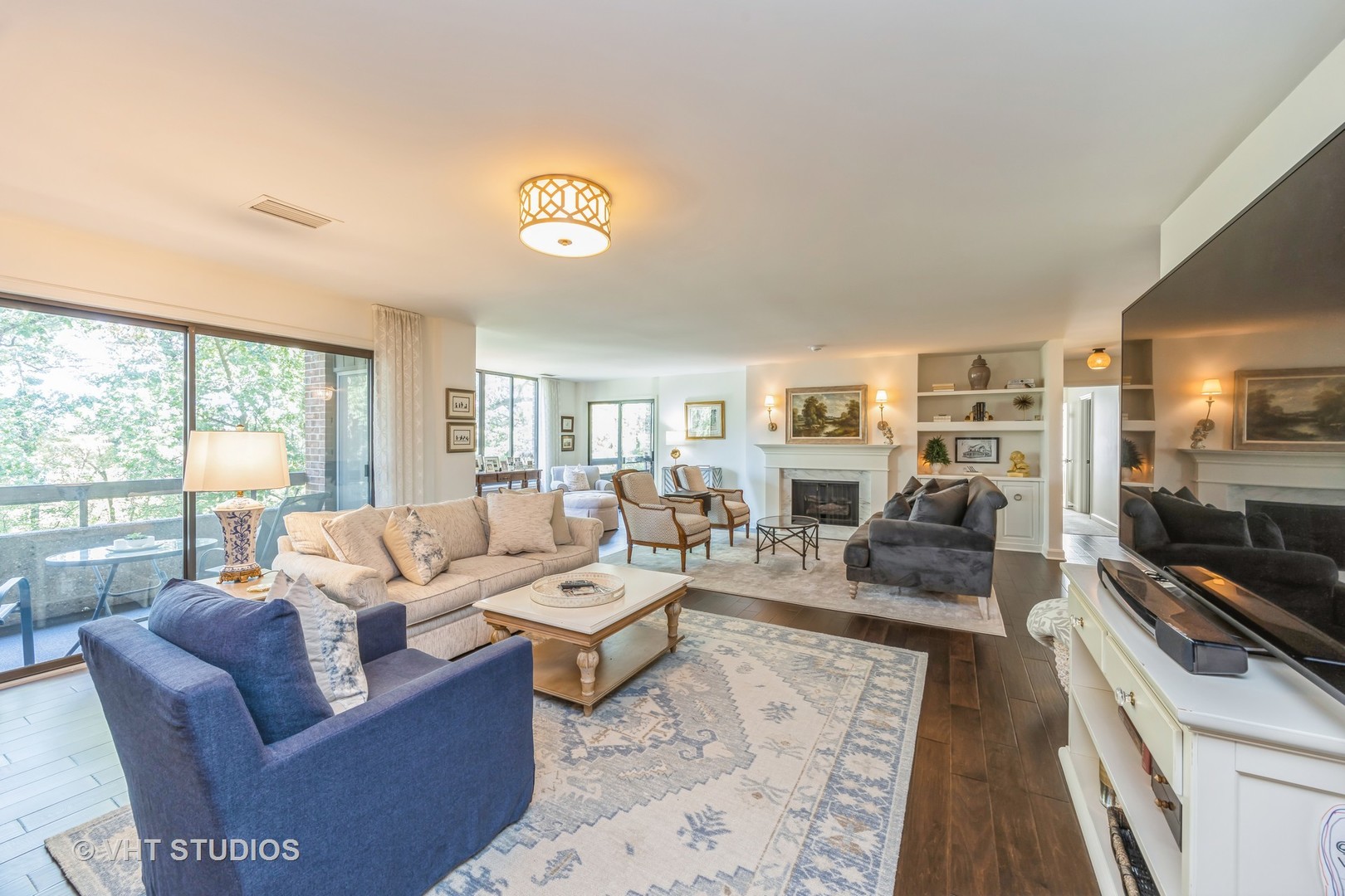 1409 Burr Oak Road, Unit 315A Hinsdale, IL 60521 - Photo 8 of 22 a living room with furniture large window and a table