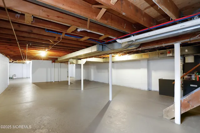a view of empty room with wooden ceiling