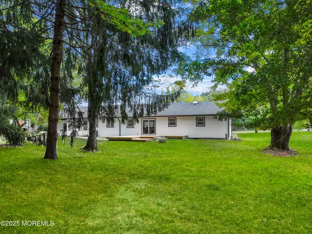 a view of a house with a back yard