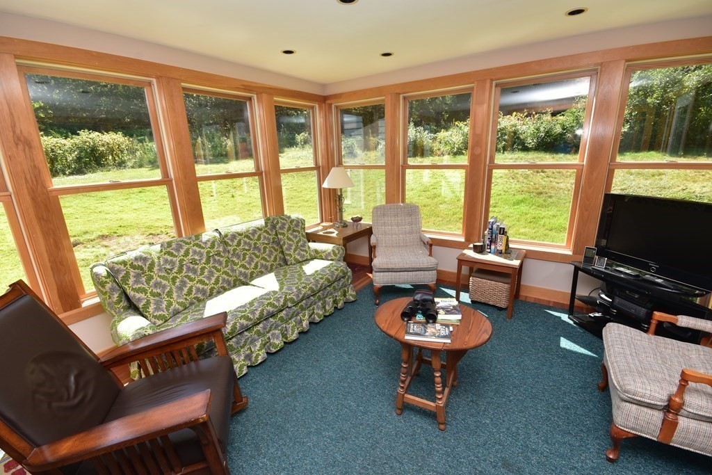 1175 Bay Road Amherst, MA 01002 - Photo 13 of 34 a living room with furniture and a flat screen tv