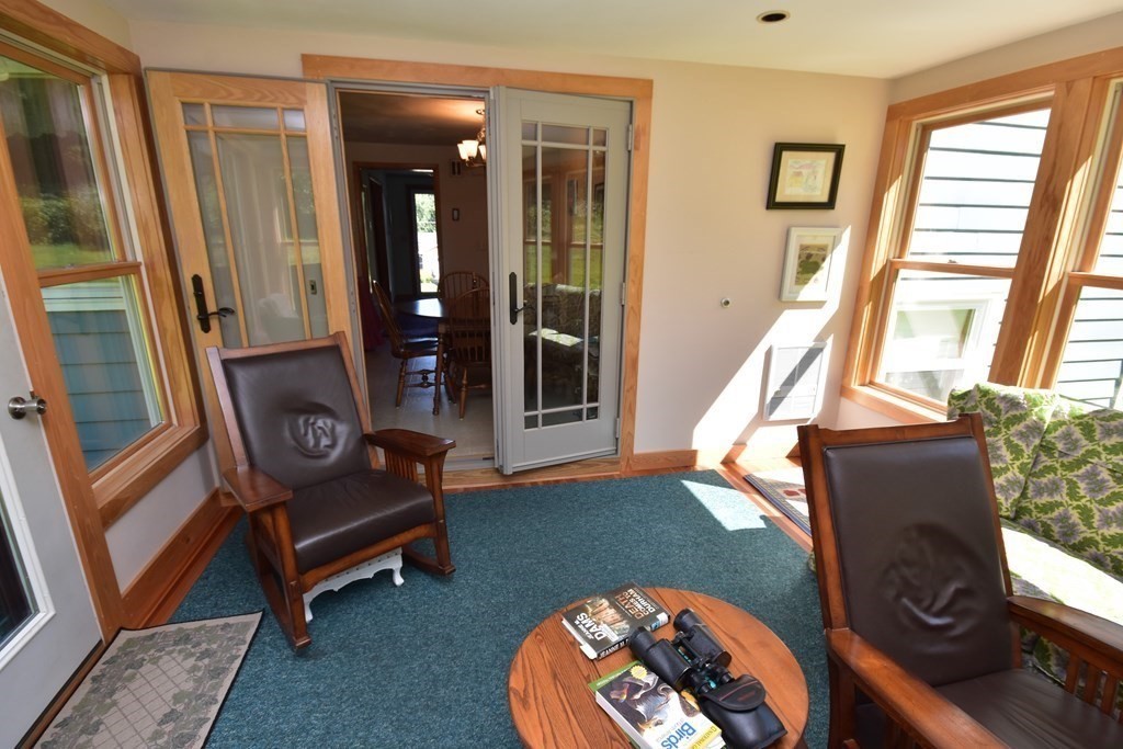 1175 Bay Road Amherst, MA 01002 - Photo 14 of 34 a living room with furniture and a floor to ceiling window