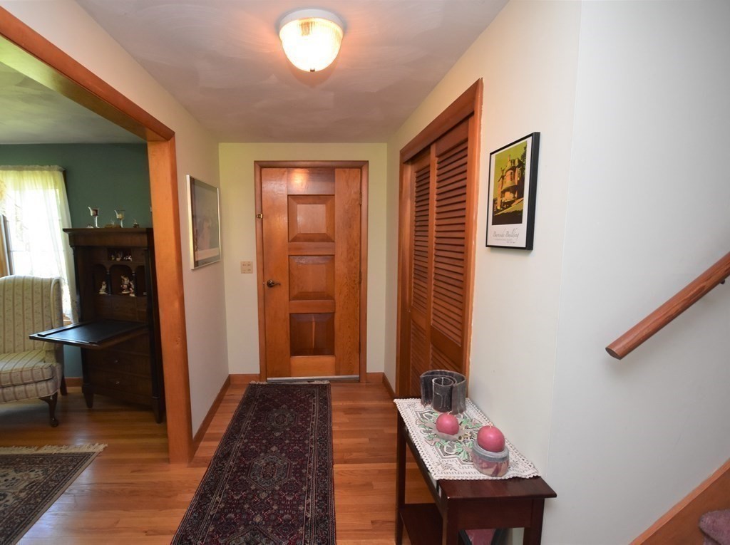 1175 Bay Road Amherst, MA 01002 - Photo 17 of 34 a hallway with furniture and a wooden floor