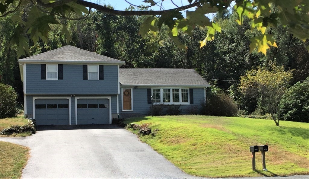 1175 Bay Road Amherst, MA 01002 - Photo 2 of 34 a front view of a house with yard