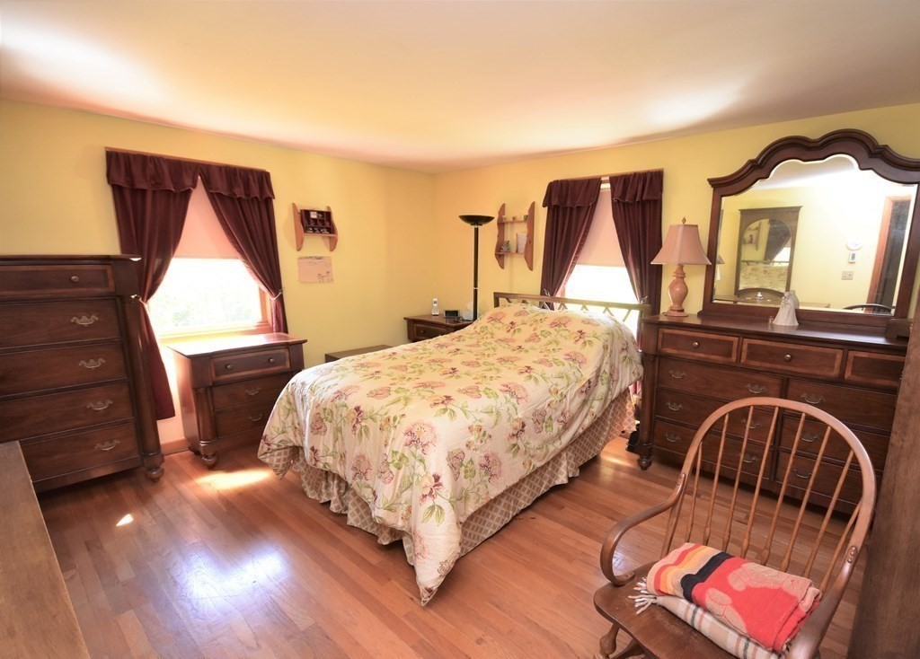 1175 Bay Road Amherst, MA 01002 - Photo 22 of 34 a bed sitting in a room next to a window