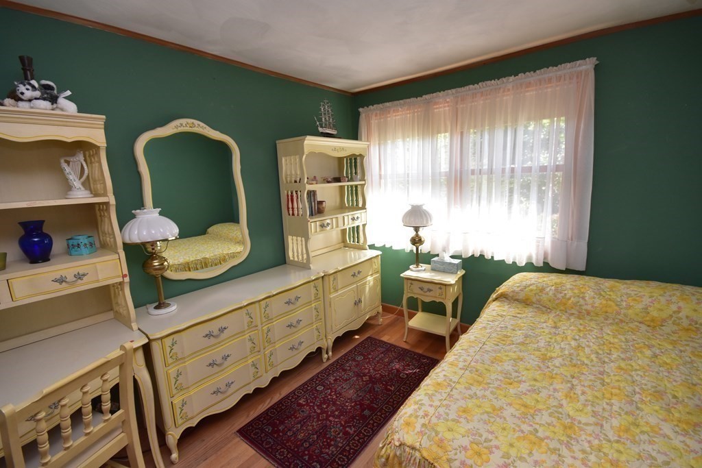 1175 Bay Road Amherst, MA 01002 - Photo 26 of 34 a bedroom with a bed and large windows