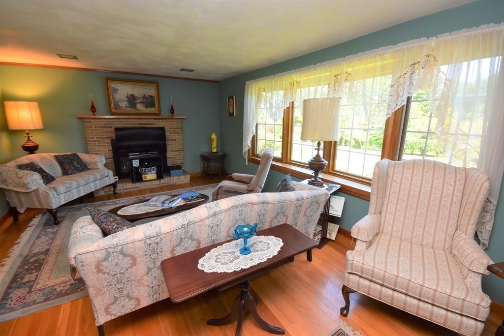 1175 Bay Road Amherst, MA 01002 - Photo 3 of 34 a living room with furniture and a fireplace