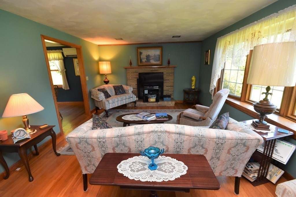 1175 Bay Road Amherst, MA 01002 - Photo 4 of 34 a living room with furniture and a fireplace
