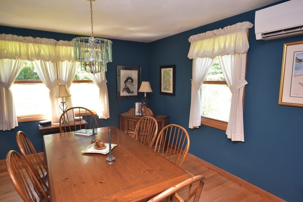 1175 Bay Road Amherst, MA 01002 - Photo 7 of 34 a dining room with furniture a chandelier and window