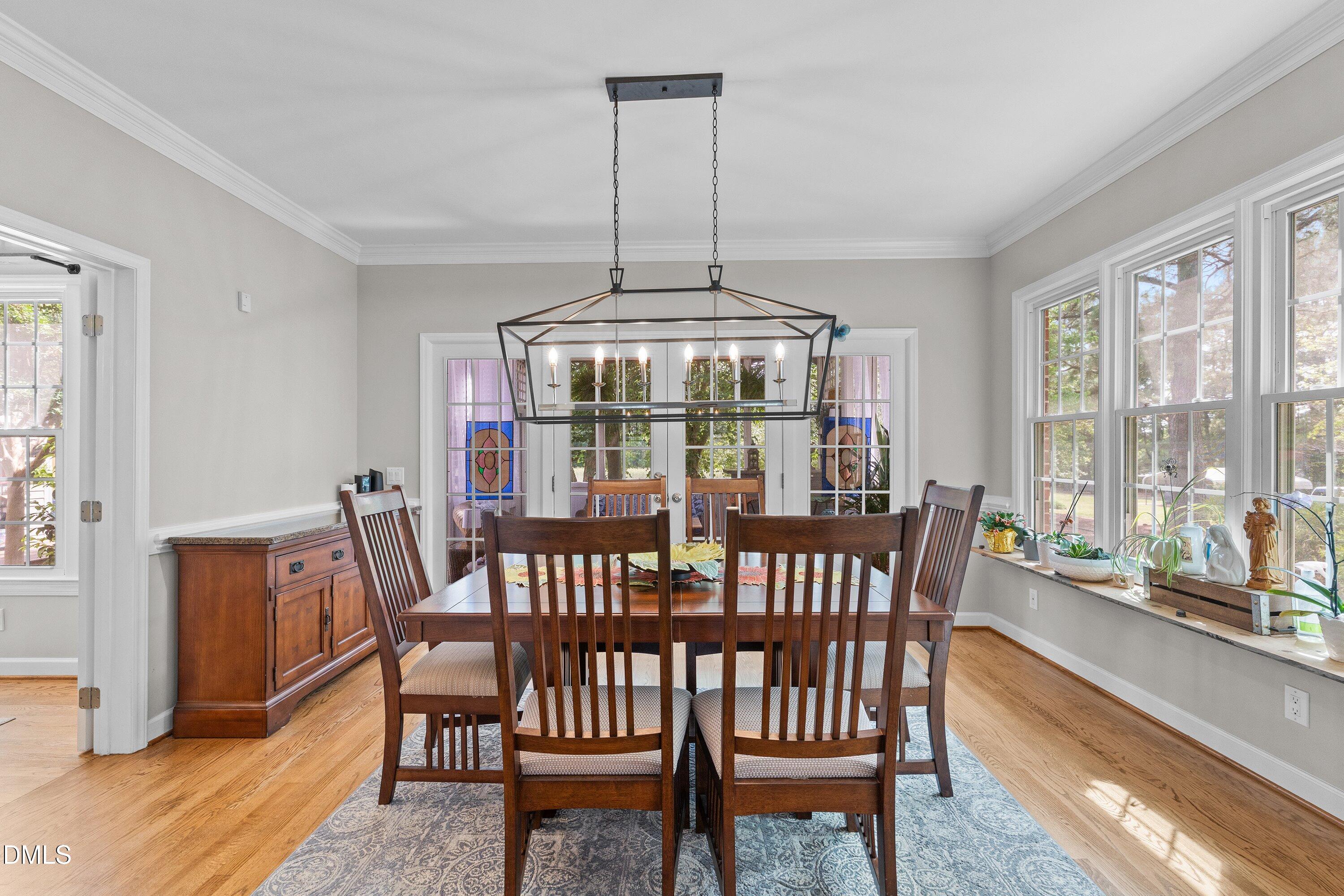6612 Fowler Road Zebulon, NC 27597 - Photo 18 of 42 a view of a dining room with furniture window and wooden floor