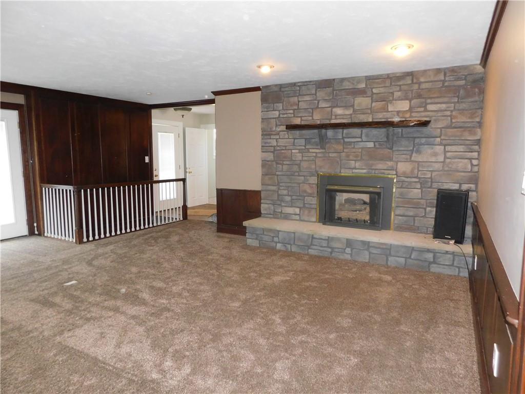 431 Old Rt 21 Road McClellandtown, PA 15458 - Photo 13 of 25 an empty room with floor to ceiling window and fireplace